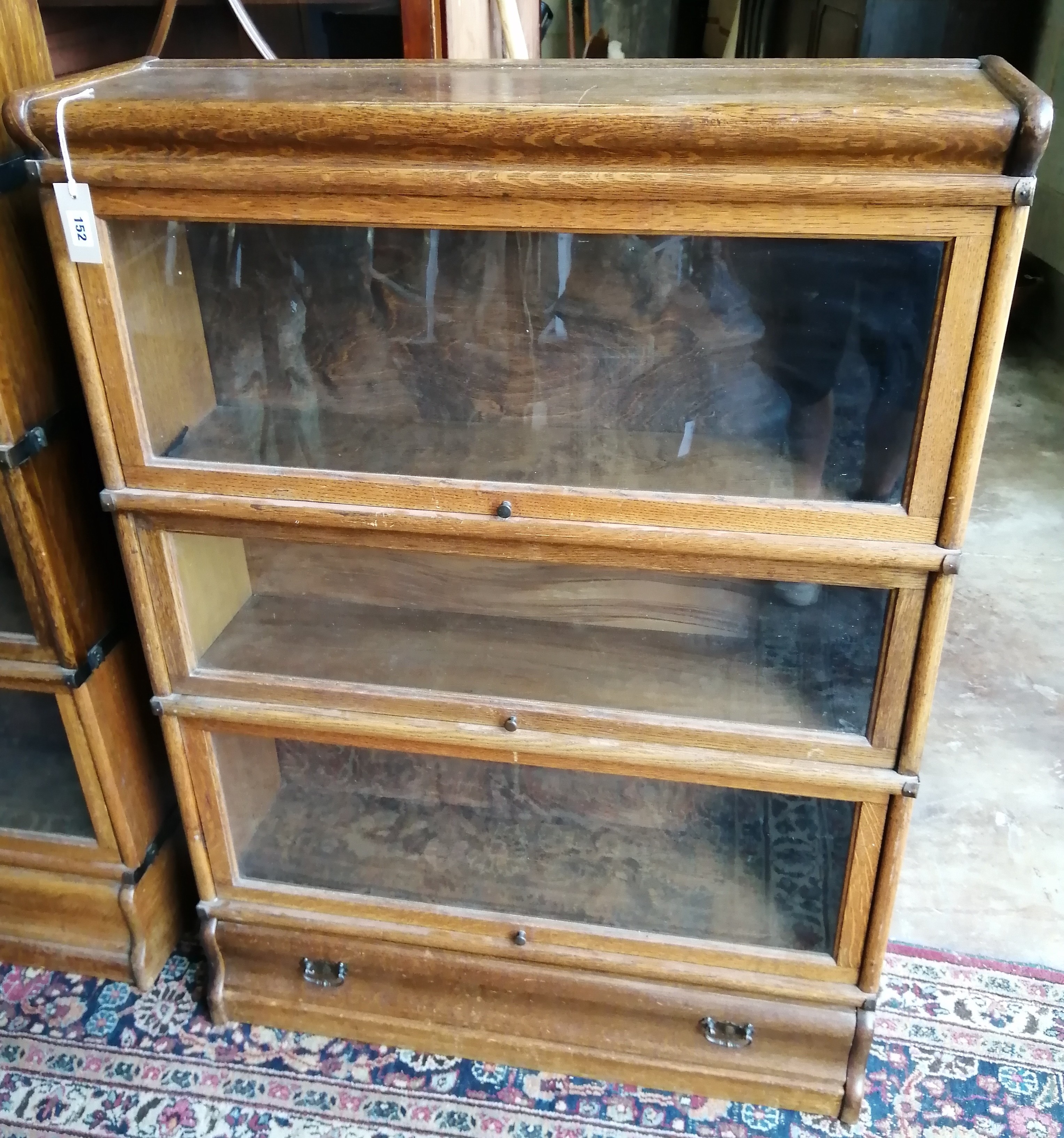 A Globe Wernicke oak three section bookcase, width 86cm, depth 27cm, height 119cm